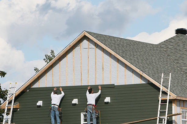 Professional Siding Contractor technician working in Dorchester, MA